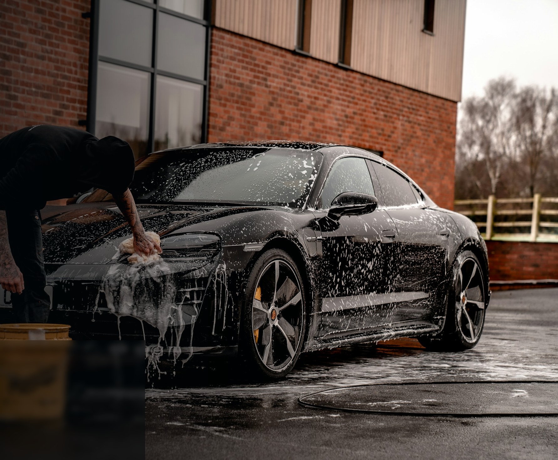 Detailed black car with polished paint under studio lighting
